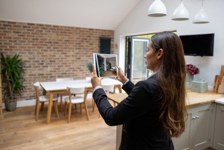 female realtor photographing dining room